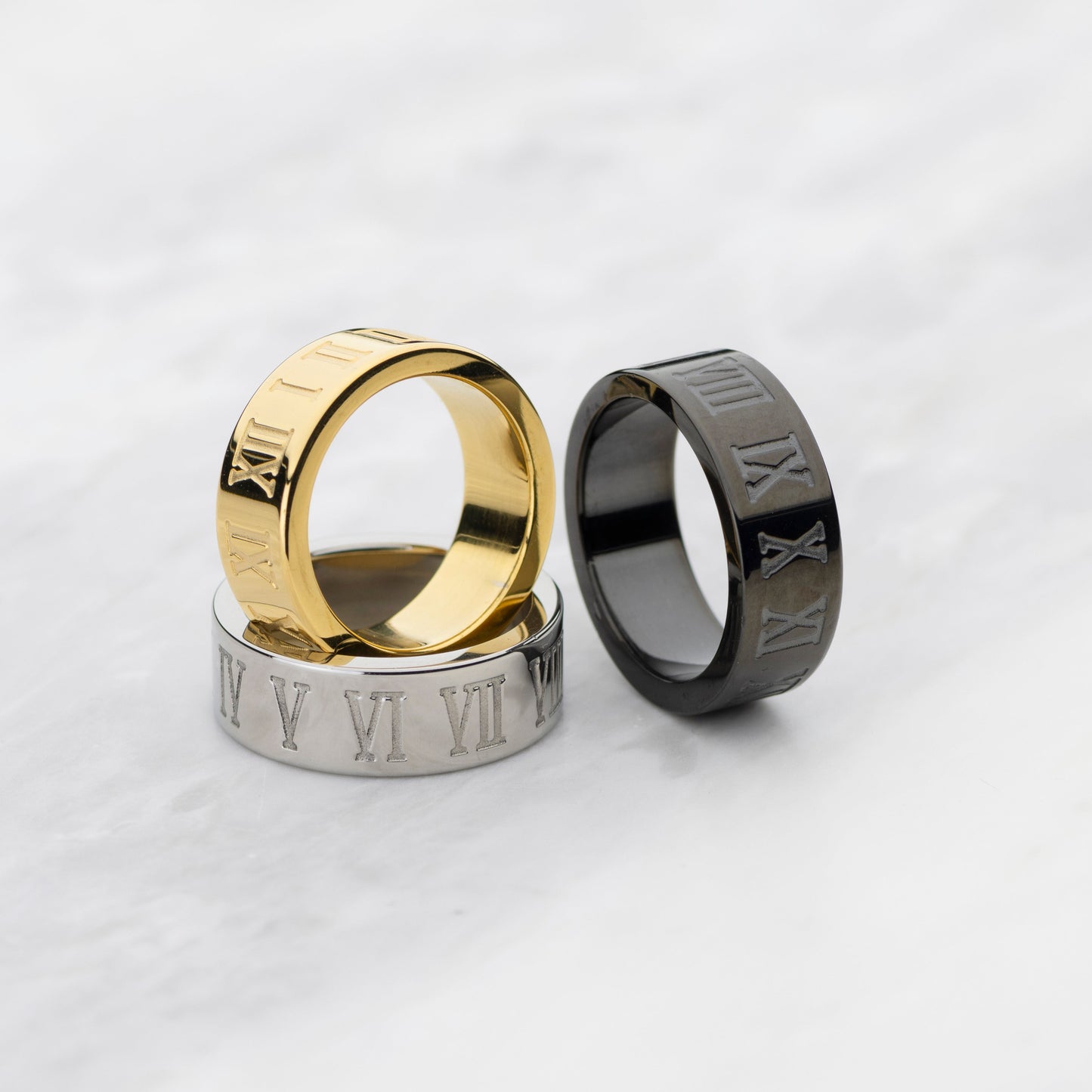 Roman 300 - Gold Ring and black ring