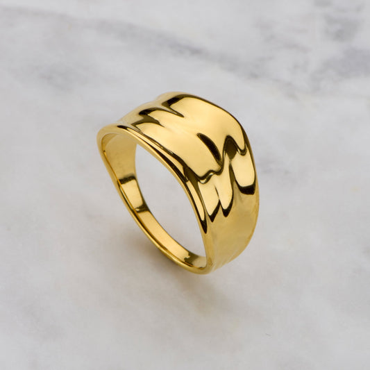 Gold ring on a marble background