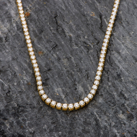 Diamond necklace on a dark stone surface