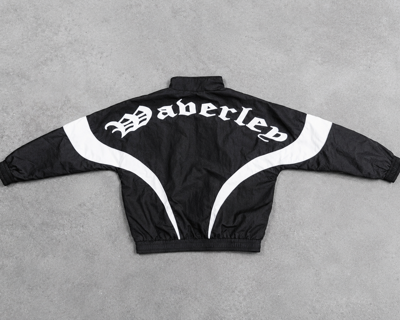 Black jacket with white accents and Waverley' branding on a grey background
