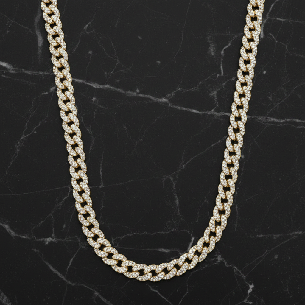 Gold chain necklace on a black marble surface