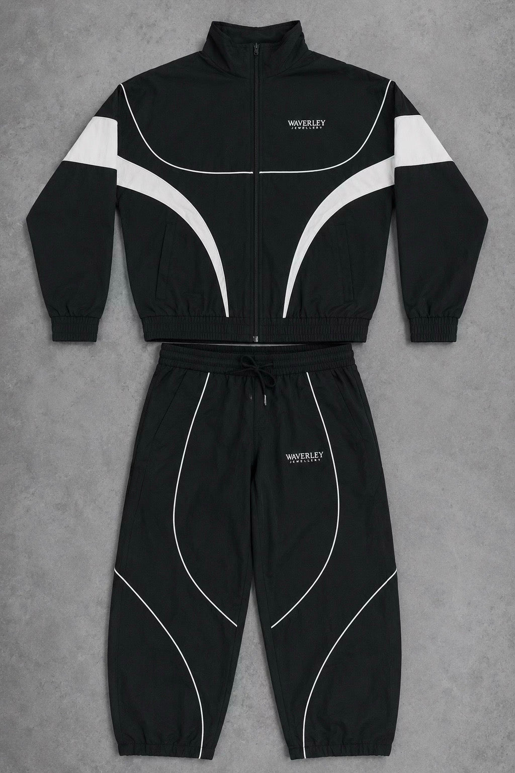 Black tracksuit with white accents on a gray background